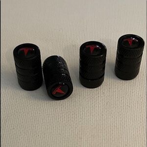 Tesla valve Stem caps in black set of 4 NWT